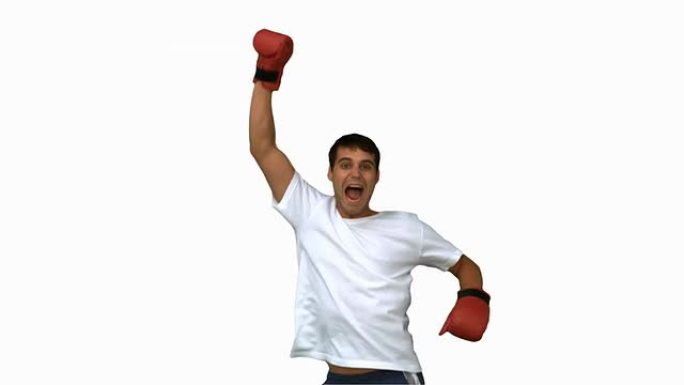 男子在白色屏幕上戴着拳击手套