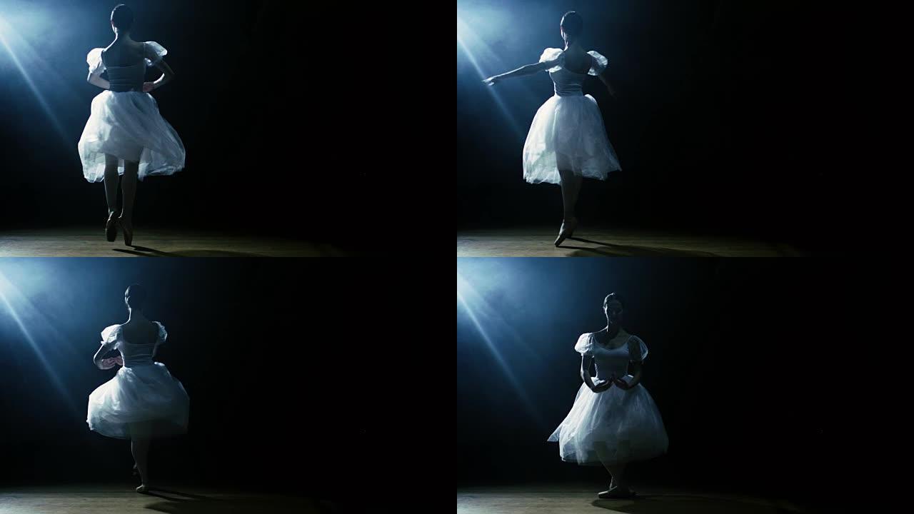 一位美丽的年轻芭蕾舞演员在聚光灯下优雅地跳舞，周围是黑暗。她穿着白色短裙，在灯光下闪闪发光。慢动作。