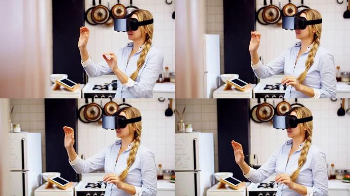 在厨房使用虚拟现实耳机的女人