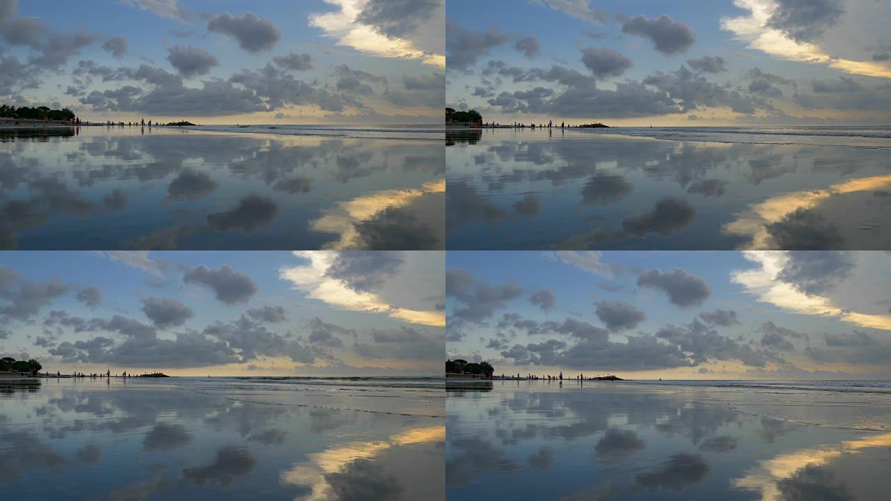 日落时，相机在库塔海滩上移动。印度尼西亚巴厘岛