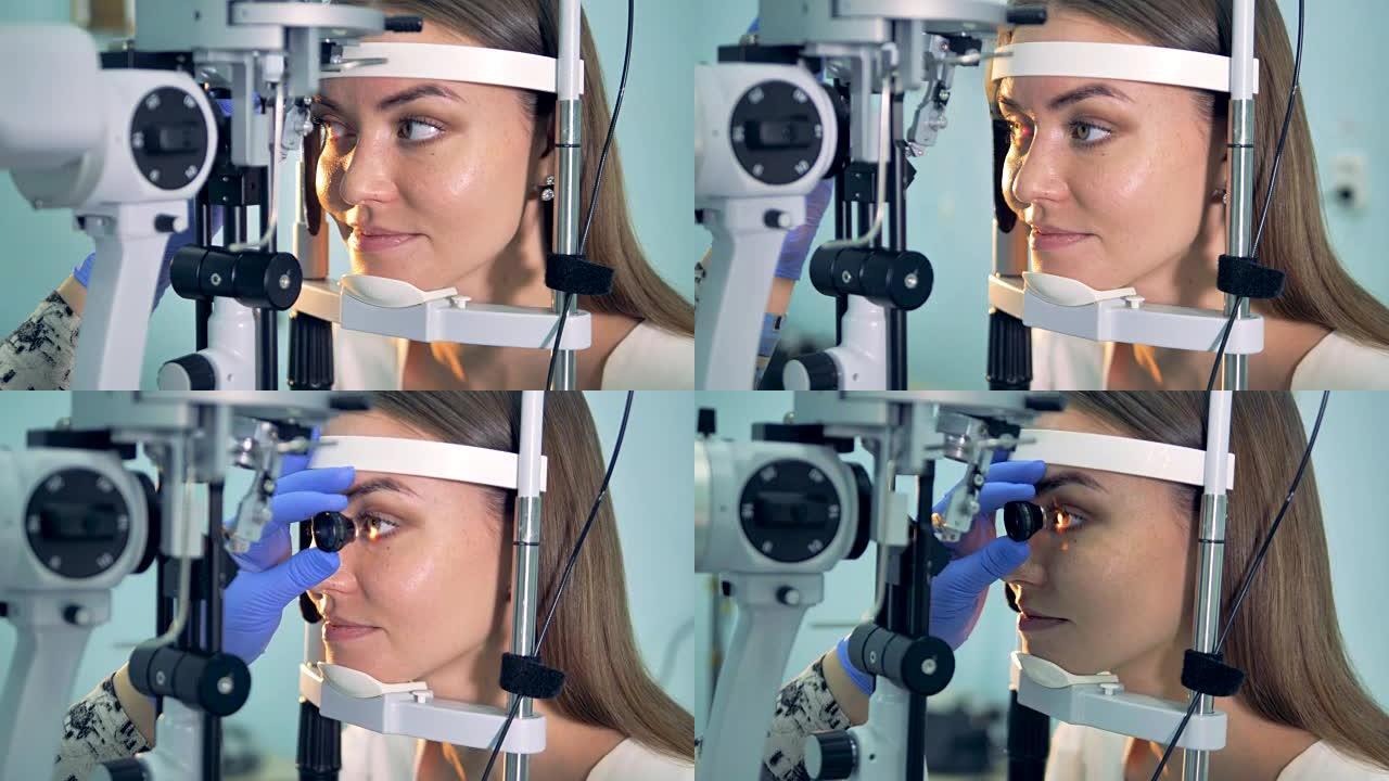 两名年轻女士的眼睛都在用特殊的眼科设备检查