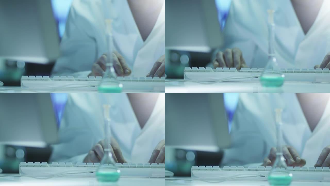 科学家正在实验室研究计算机。特写。在4k (UHD) 的红色电影相机上拍摄。