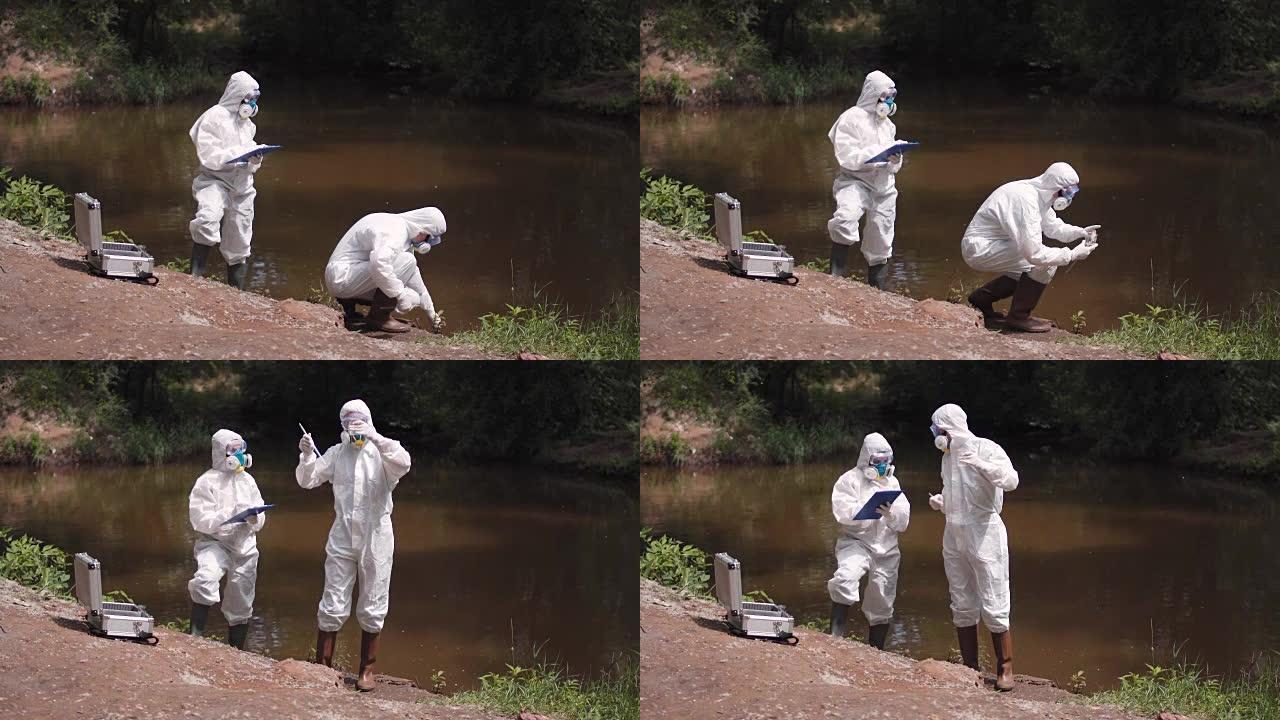 两名科学家从河流中提取水样