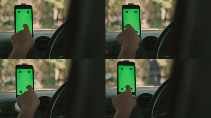 女人在带有GPS，绿屏的汽车中使用智能手机
