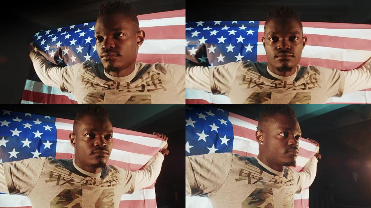 非裔美国男性，手握美国国旗