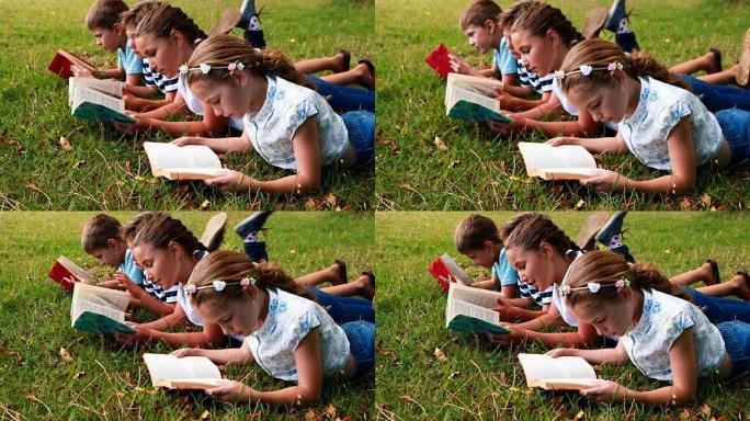 孩子们躺在草地上看书