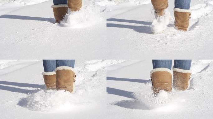特写: 无法识别的女孩穿着冬靴踩着新鲜的未触及的雪