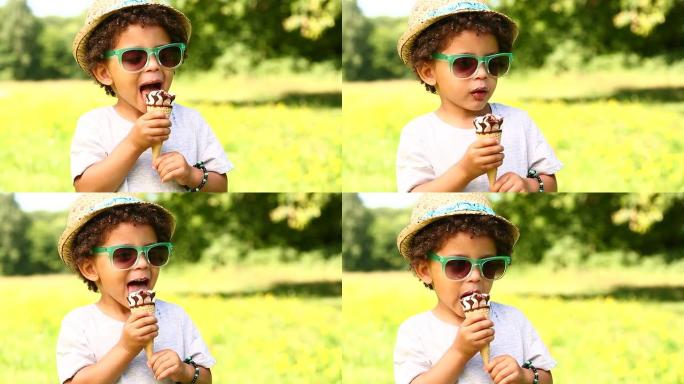 小男孩在蛋筒里舔冰淇淋