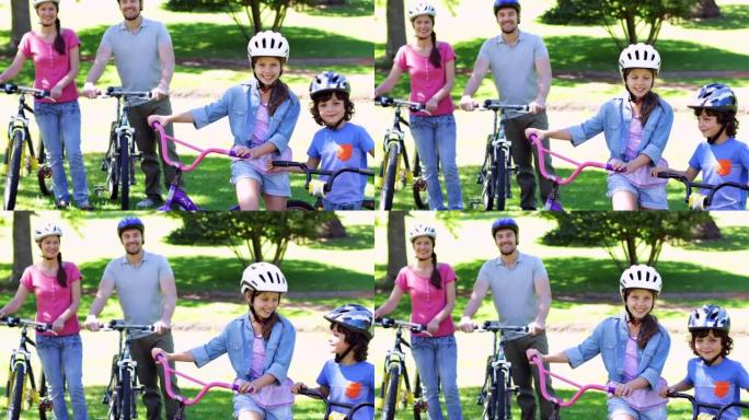 微笑的家人一起在公园骑自行车