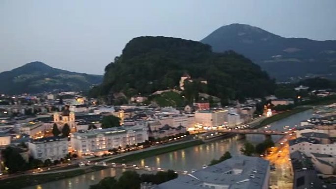 平移镜头: 鸟瞰图萨尔茨堡沿萨尔扎克河的城市景观奥地利