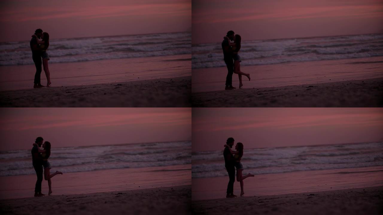 日落时海滩上的情侣视频