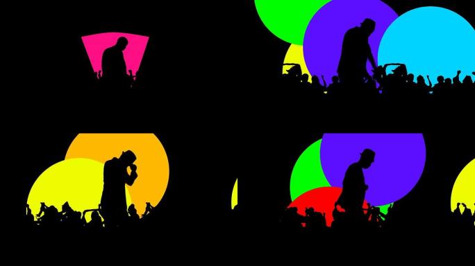 一个男人在五颜六色的聚光灯下跳舞的剪影