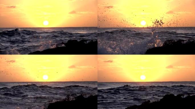 慢动作特写: 海浪在金色的日落时分溅入多岩石的海岸