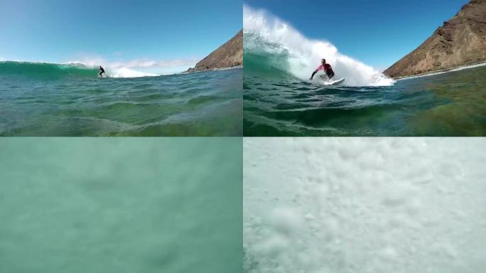 水下慢动作: 冲浪男子冲浪大浪通过相机