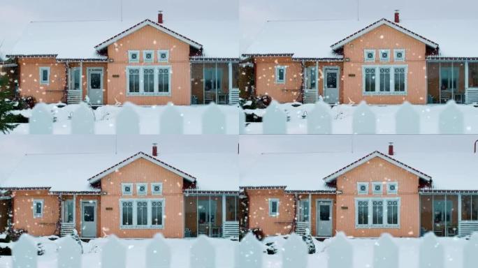 美丽的冬景，田园般的房子有华丽的后院和栅栏。冬天下雪了。
