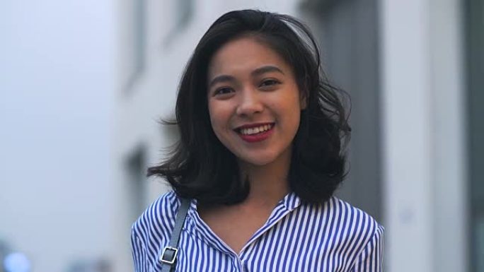 年轻亚洲女性微笑肖像，4k