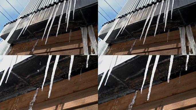2发冰柱从屋顶融化，在晴天滴落