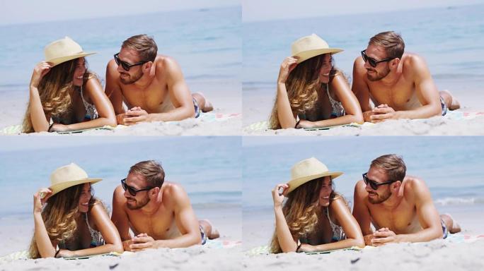 躺在海滩上的浪漫情侣