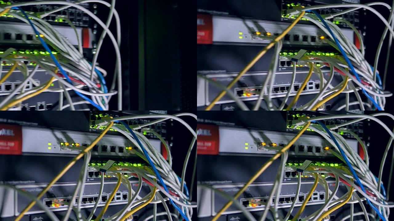 一堆插在网络交换机上的许多跳线。4K。