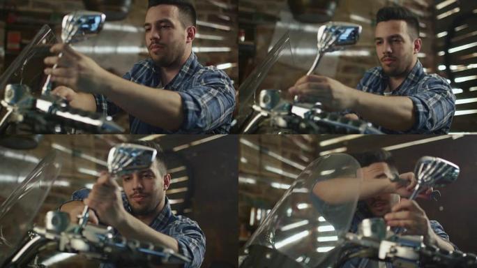 男子正在用扳手拧紧螺母，并在车库里修理摩托车。
