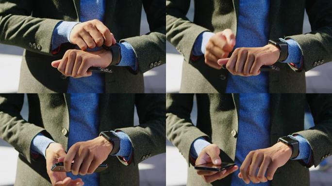男人使用智能手表和手机4k