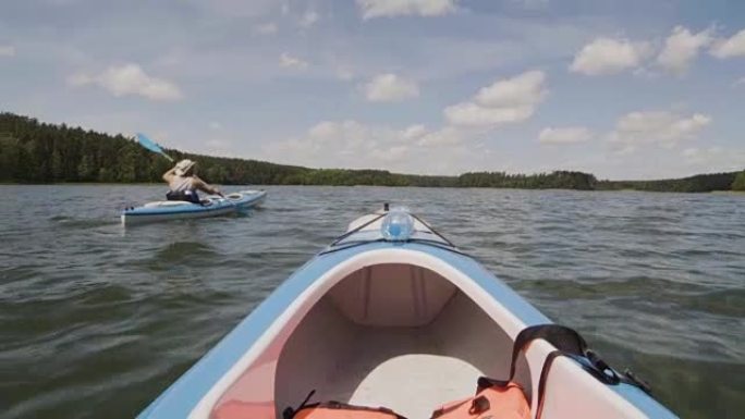 Summer relaxing activity. Friends kayaking on the 