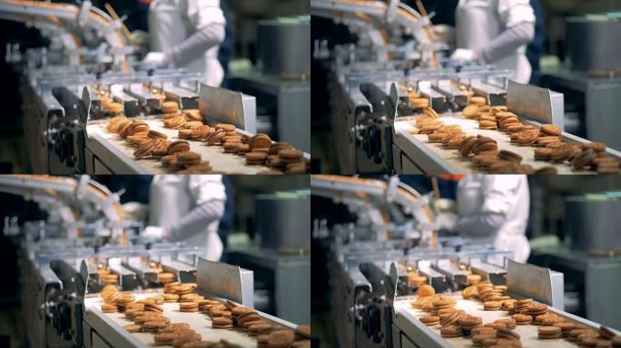饼干沿着工厂机器的传送带走下，背景是4k的工人。