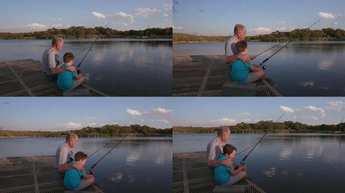 祖父和孙子在一个小湖钓鱼