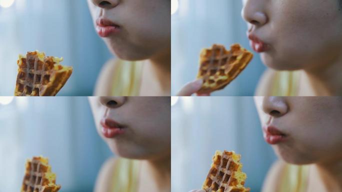 特写女人嘴吃华夫饼