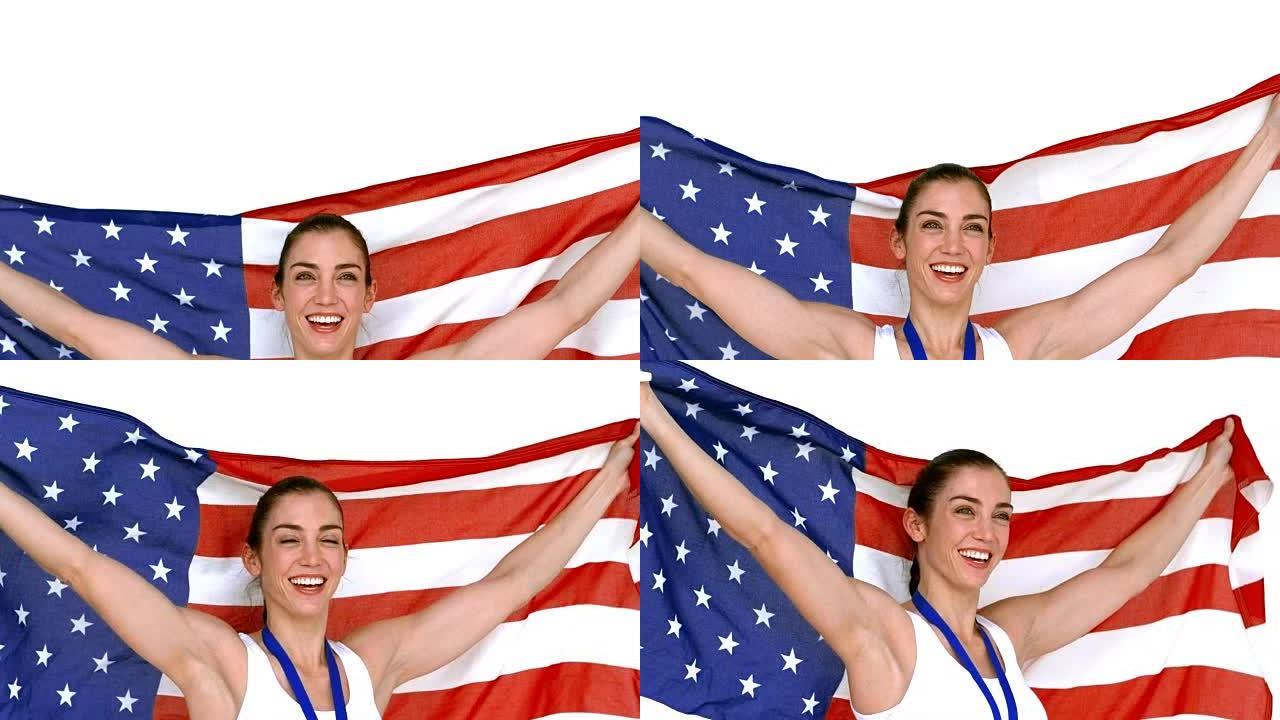 快乐的运动员举着美国国旗