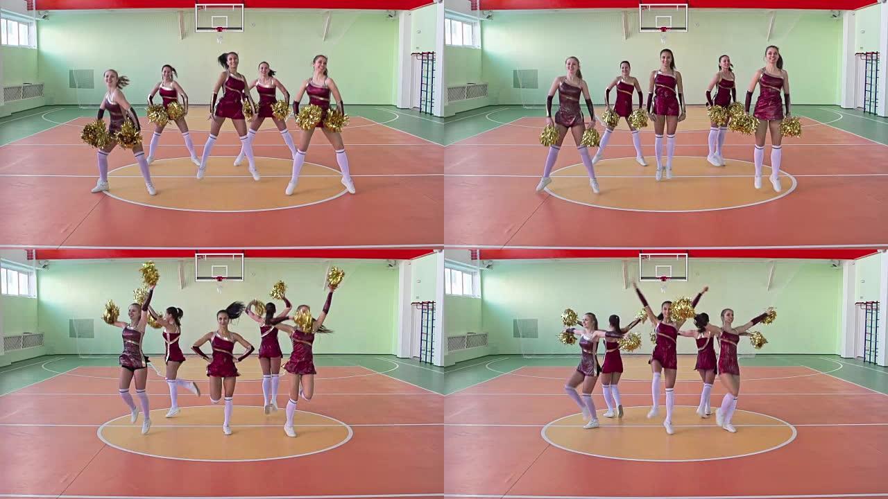 一群啦啦队在学校体育馆跳舞