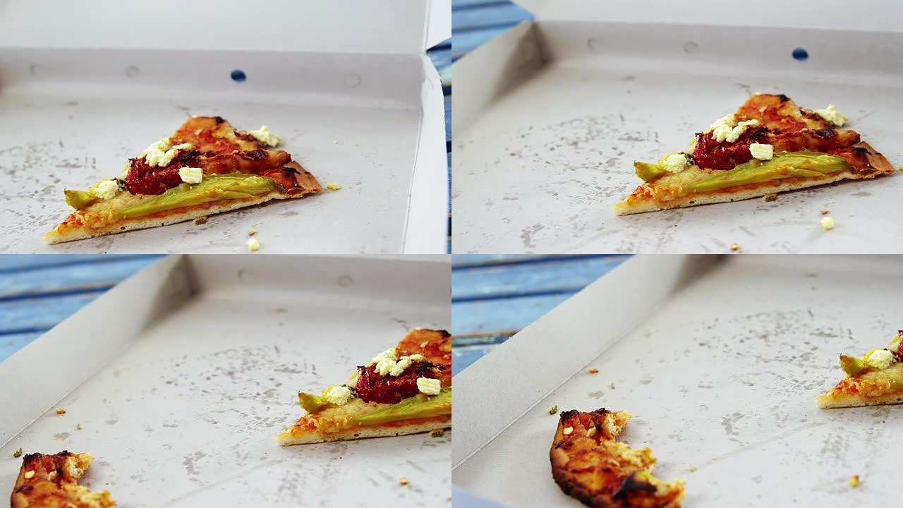 披萨盒中缺少一口的披萨片