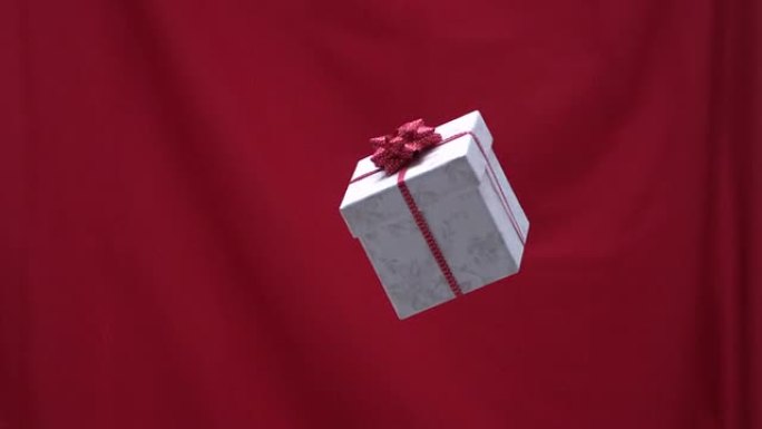 圣诞礼物被扔进红色背景