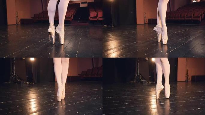 一个芭蕾舞演员踩在她的鞋尖上。