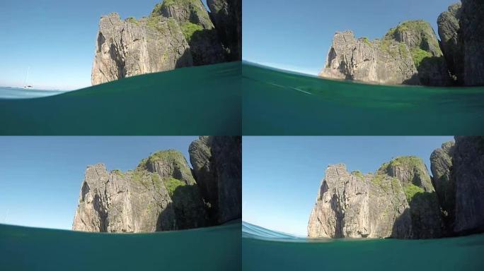 半水下平静的海浪滚过披披群岛附近的石灰岩岩溶体