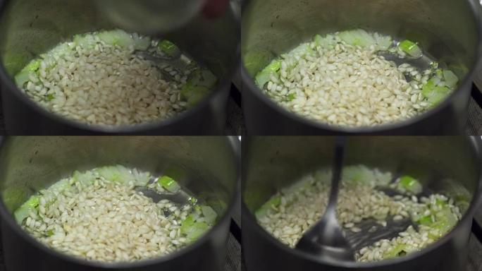 烹饪油炸意大利米饭和洋葱