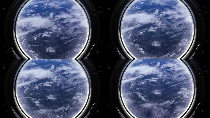 透过宇宙飞船的窗户可以看到地球。国际空间站。飞走了。现实的氛围。体积云。从太空看。太空，地球，轨道，