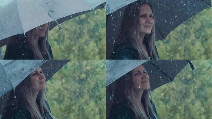 金发女人在雨中扭伞