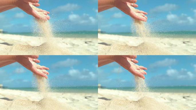 慢动作: 小沙粒筛过无法辨认的女人的手指。