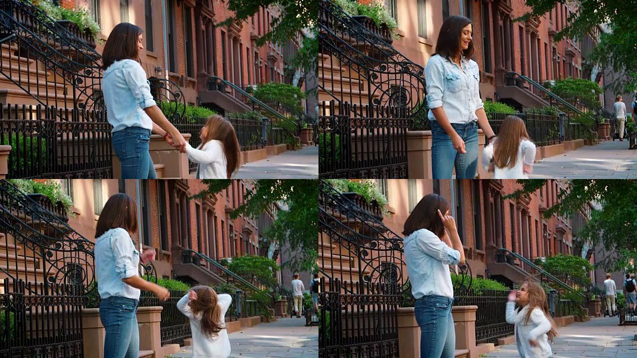 年轻的母女在布鲁克林街头玩耍