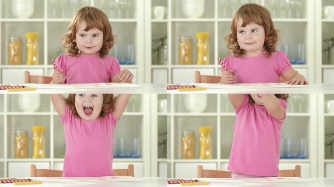 高清: 快乐的小女孩画画和玩得开心