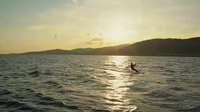 4k人风筝在宁静的日落海洋上航行，实时