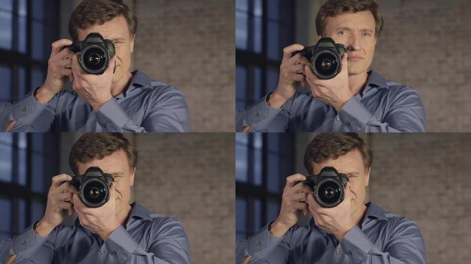 用专业相机拍摄照片的成功摄影师的慢动作肖像。商人系列。
