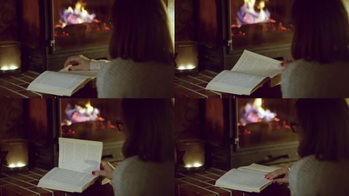 4k女人在舒适的壁炉旁读书，实时