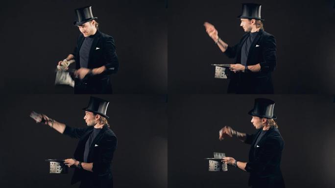 一位男性巫师正在玩纸牌并将其变成帽子