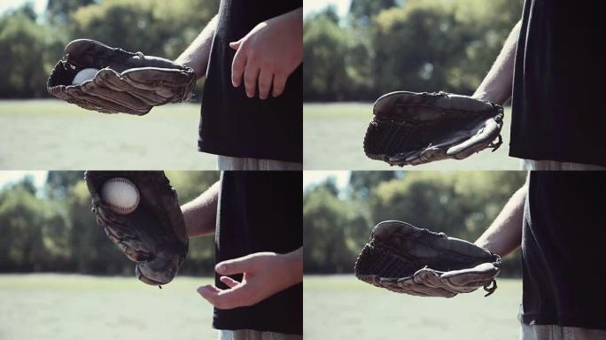 棒球运动员将球扔进手套