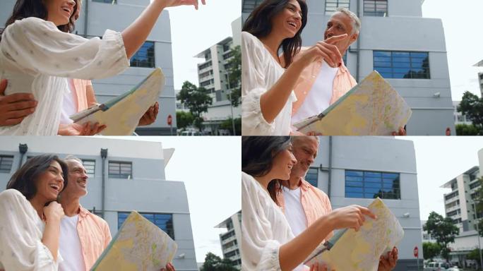微笑的夫妇检查地图