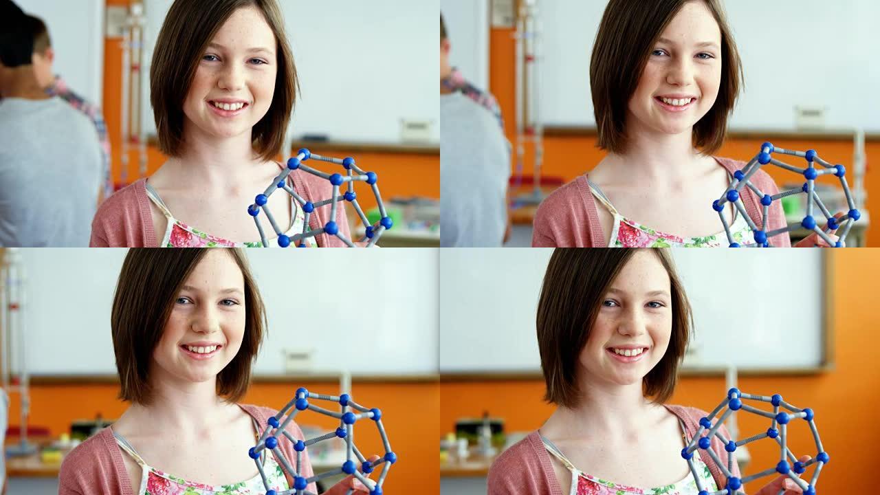 快乐女学生在实验室实验分子模型的肖像