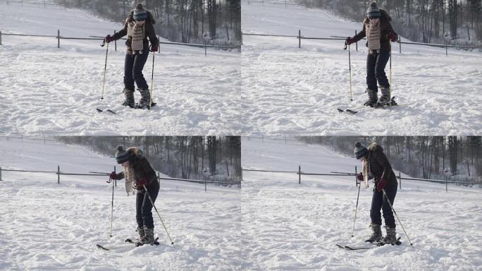 女性穿上滑雪板