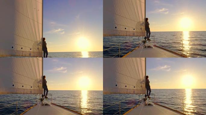 日落时从桅杆到帆船上的女人